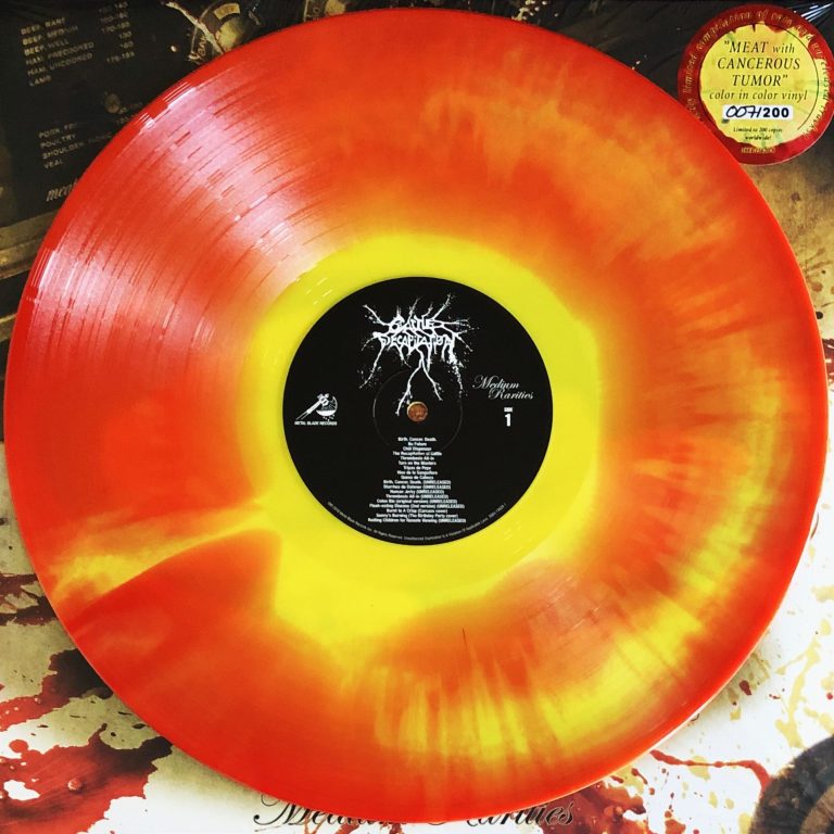 Buntes Vinyl in Orange und Gelb mit schwarzem Label in der Mitte.